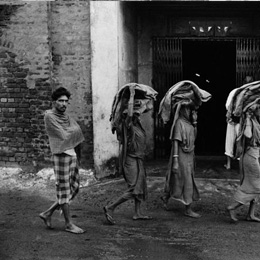 Workers carrying leather on their head, Tangra, Calcutta                                                                                                                                                