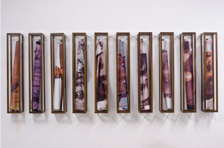 Riyas Komu | Roll Models | 2011 | Digital printing on polyester micro- frame is made up of Acrylic and wood (Set of 10) | 48 ” x 8″