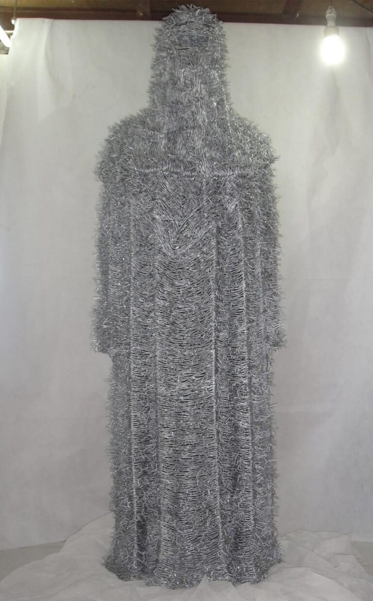 Valay Shende | Untitled | 2010-2011 | Metal barbed wire and silver powder coating. LCD screen and DVD player | 72 x 24 Inches