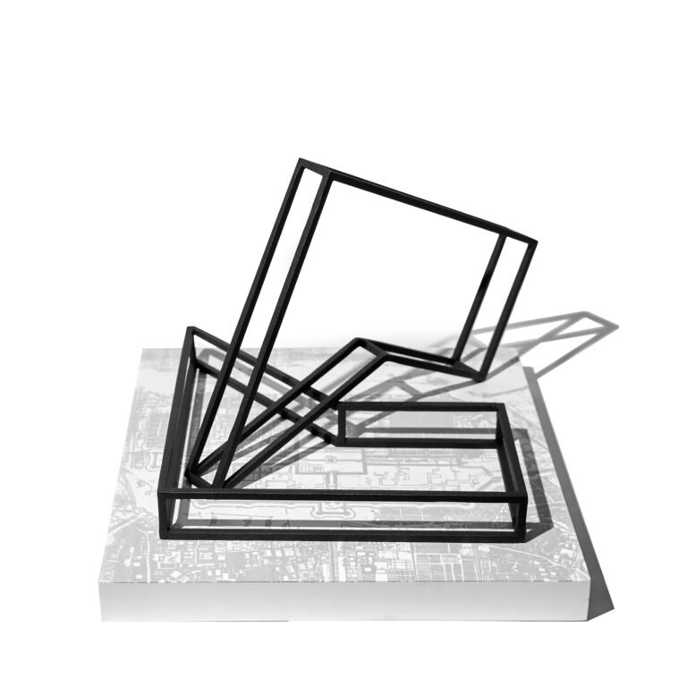 Chetnaa | In Motion I | 2025 | Mild steel with powder coating and wooden base with screen print (Set of 2 units and a base) | 10(H) x 10(W) x 10(D) Inches approx. | Base: 1.5(H) x 13(W) x 13(D) Inches