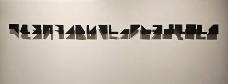 Chetnaa | Suspended I-XIX | 2025 | Powder coating on 3mm mild steel (Set of 19 units), 4(H) x 4(W) x 1.5(D) Inches each | Display size: 4(H) x 85(W) x 1.5(D) Inches